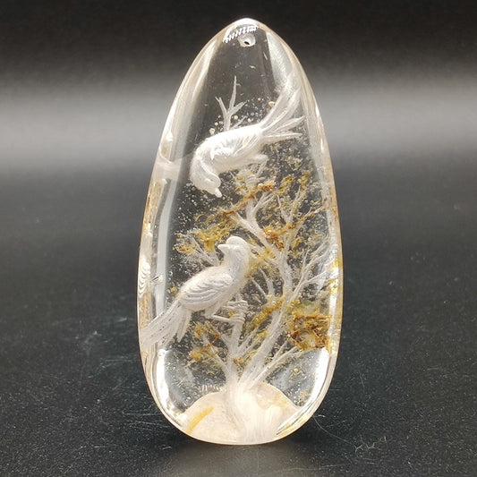 Colgante de cuarzo con talla de aves