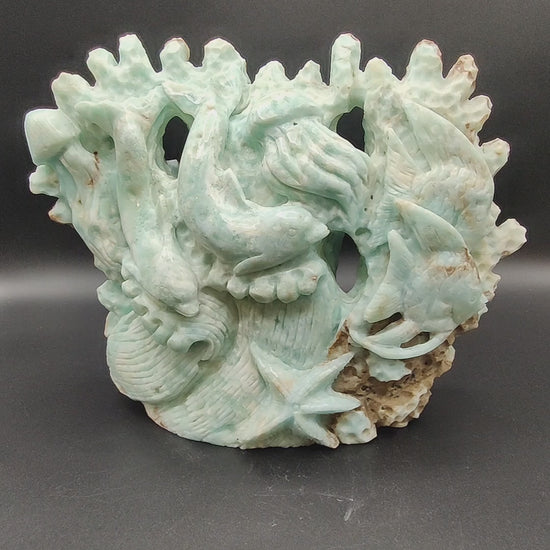 figura tallada a mano de fondo marino en aragonito azul